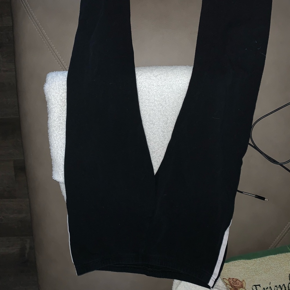 Black leggings with two stripes along the side.